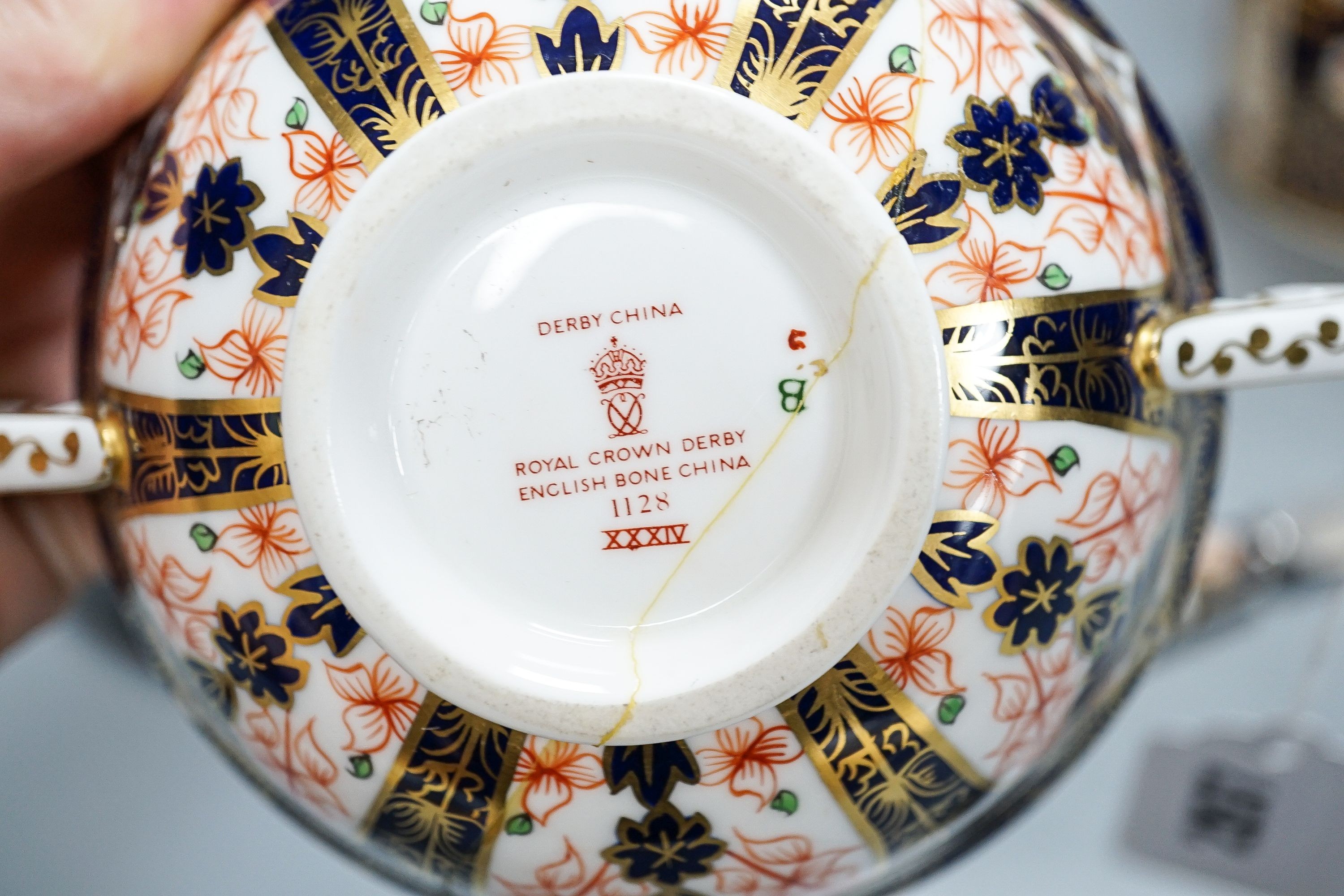 Royal Crown Derby tableware, including pair of dinner plates, 26cm, together with a pottery Imari pattern box and cover